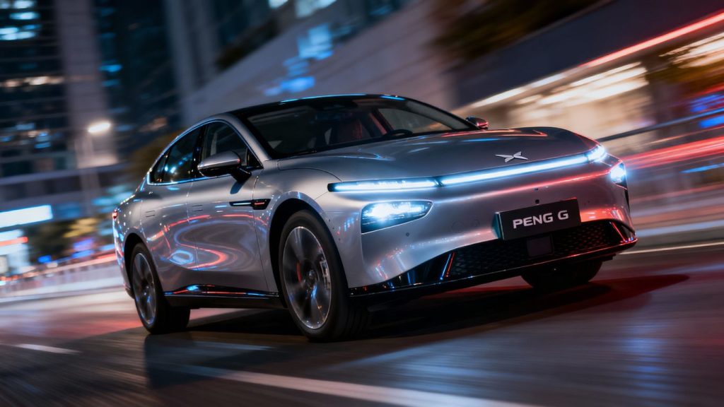 XPENG G6 electric SUV driving on a city street.